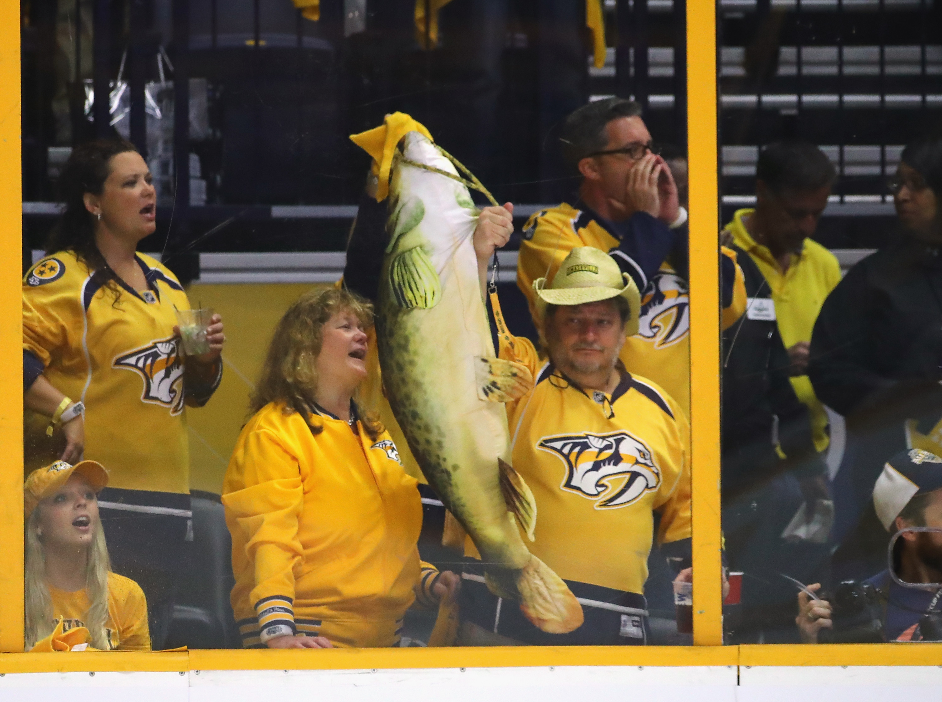 Catfish clad with gold party hat and Preds cape thrown on the ice : r/hockey