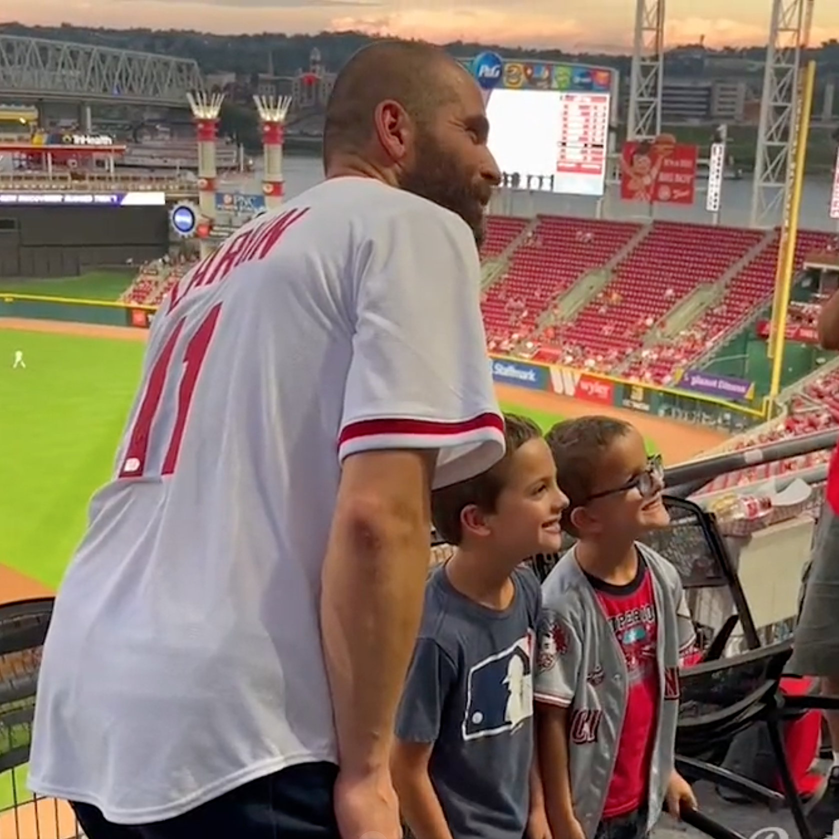 Joey Votto hanging out in the stands with Reds fans while out with